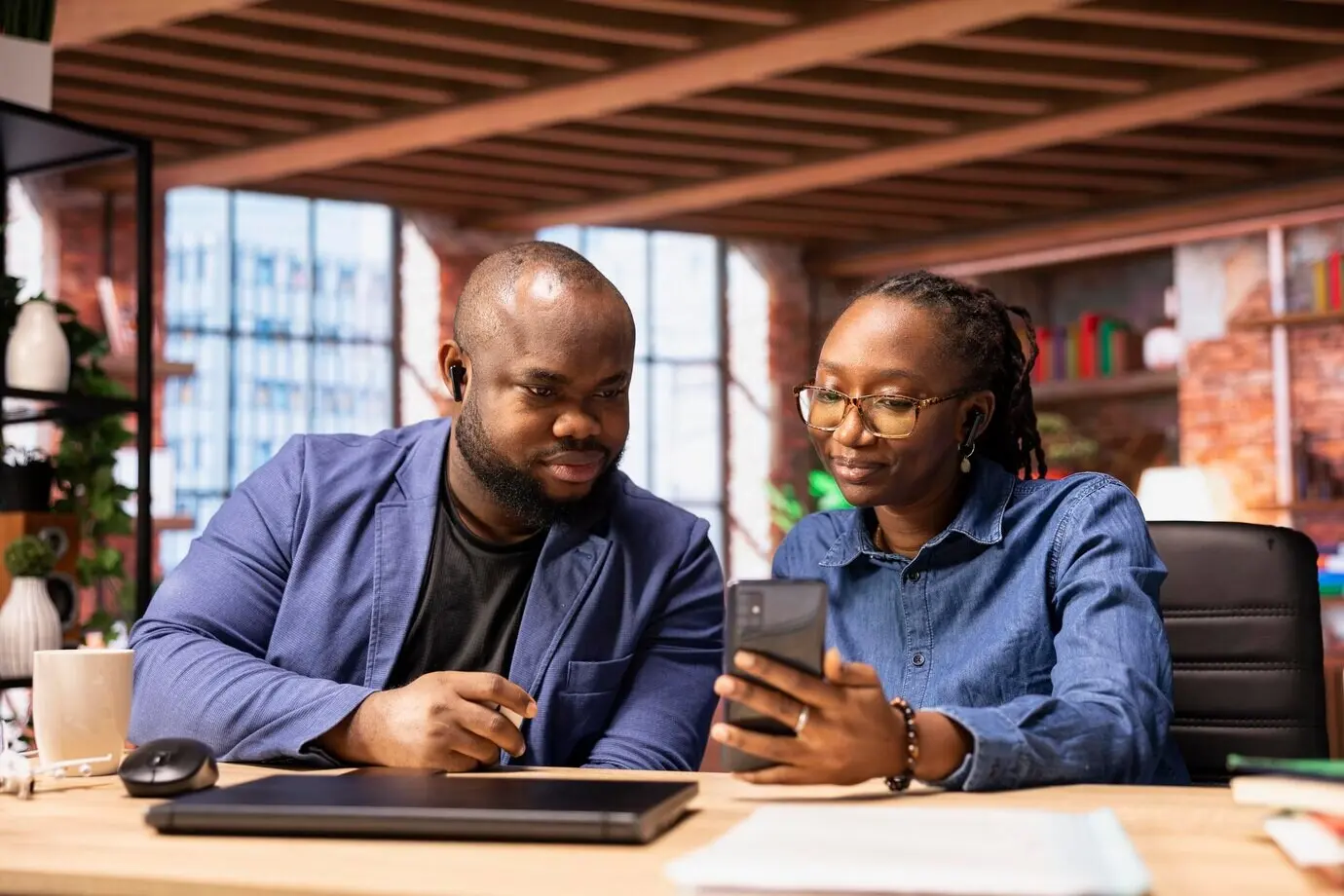 Young adults joining a family meeting on a video call through an internet connection.